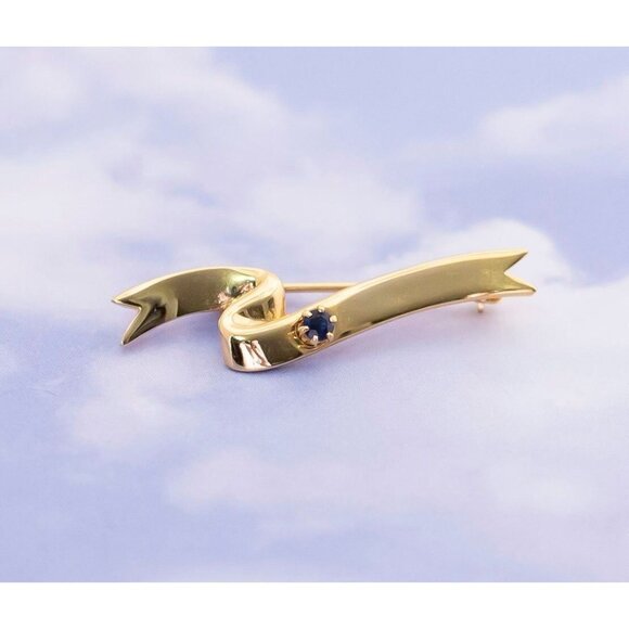 Vintage Wavy Navy Blue Rhinestone Gold Tone Brooch by Avon - S5 - Picture 1 of 3